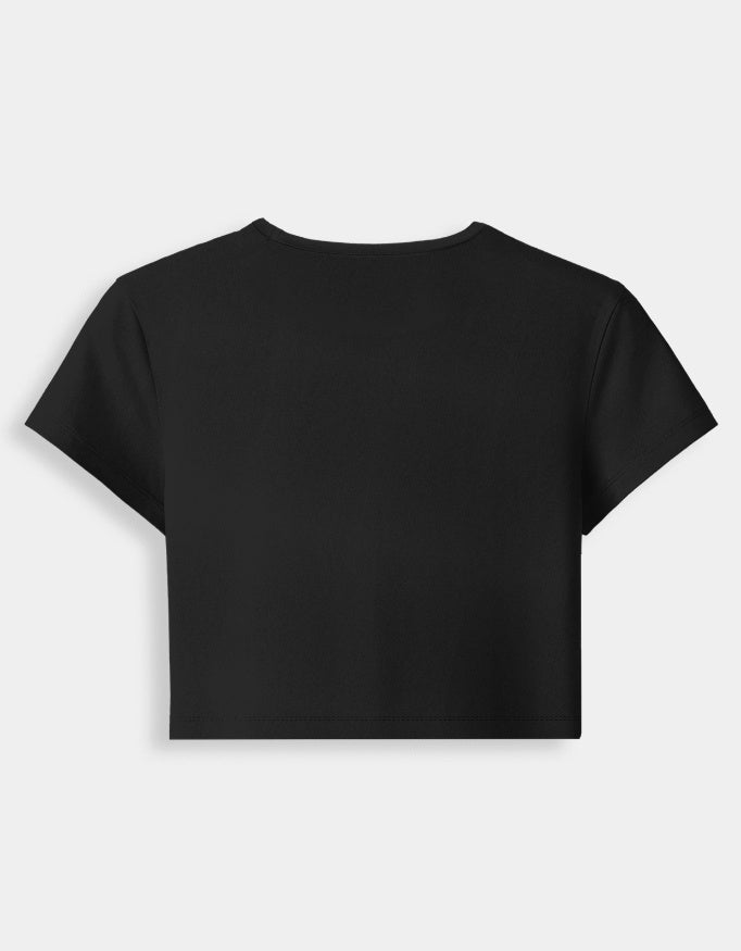 Black crop top on a light gray background
Premium stretch cotton fabric of CozyVora baby tee – soft-touch cropped t-shirt for women in neutral tones