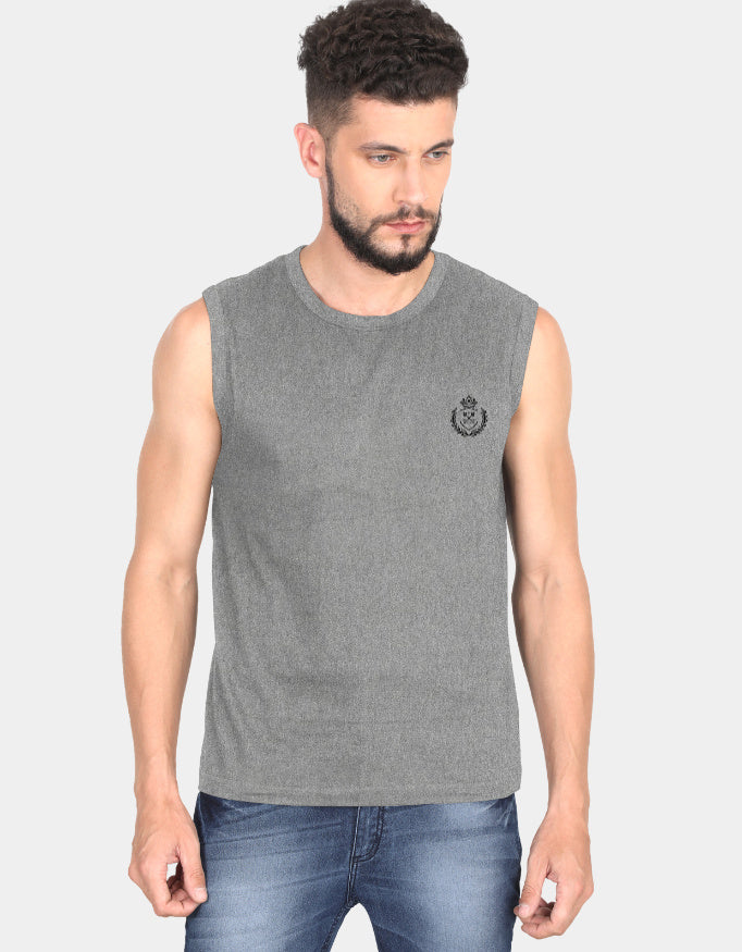 Man wearing a gray sleeveless shirt with a small logo on a light gray background
Clyne Tee