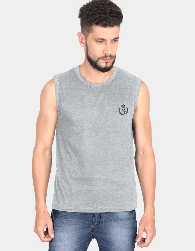 Man wearing a gray sleeveless shirt with a logo on a light gray 
Clyne Teebackground