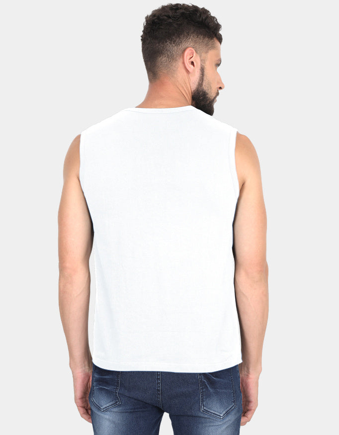 Man wearing a white sleeveless shirt and blue jeans on a plain background
Clyne Tee