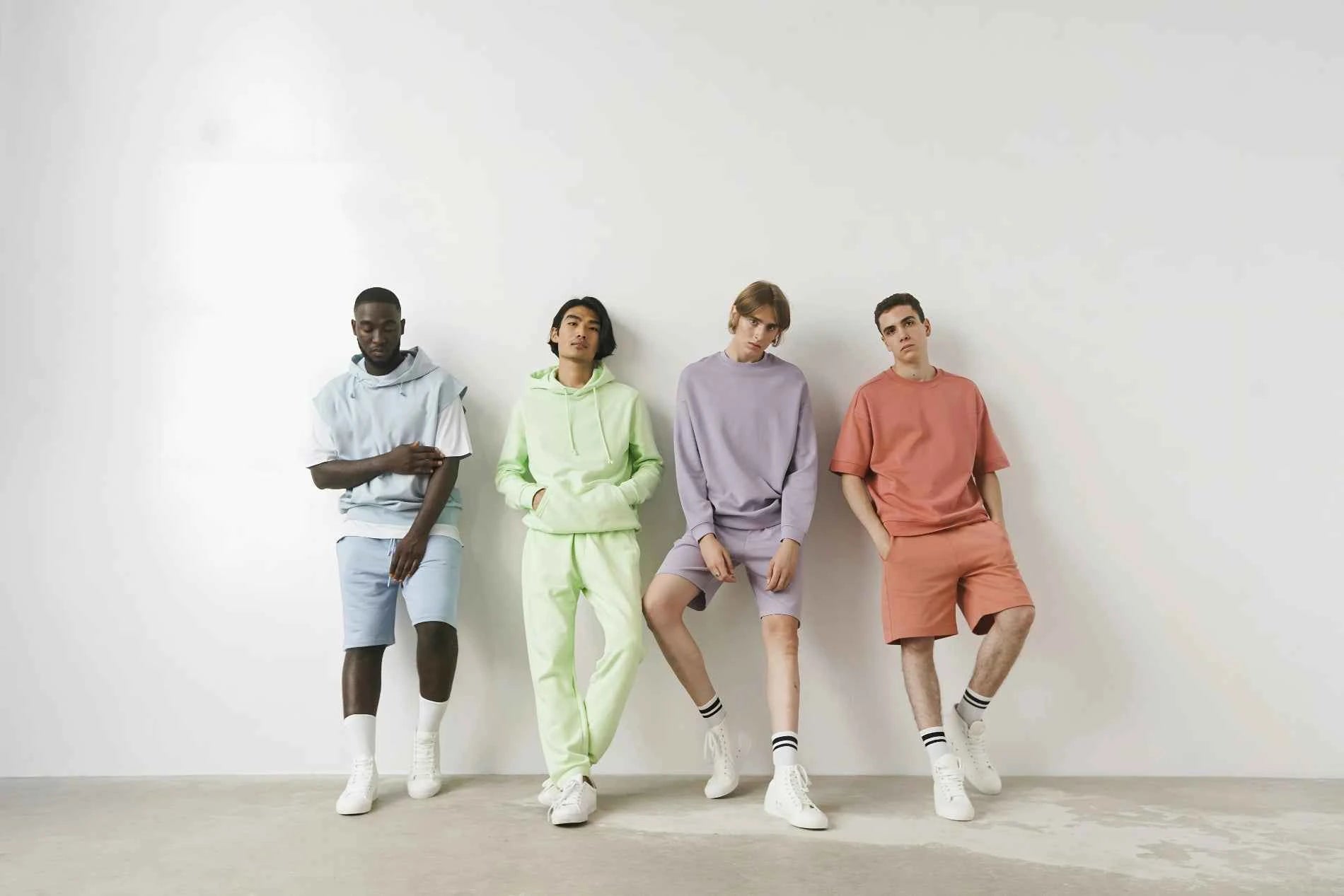 Four CozyVora models wearing pastel-colored outfits standing against a white wall.