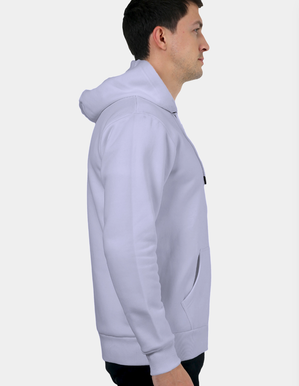 Person wearing a lavender hoodie on a white background