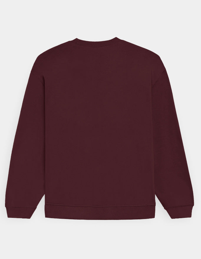 Back side of Maroon sweatshirt on a light gray background