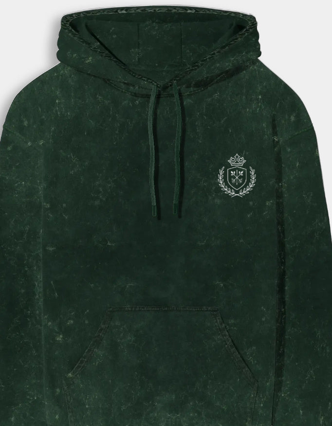 Green hoodie with a logo on the chest against a light gray background