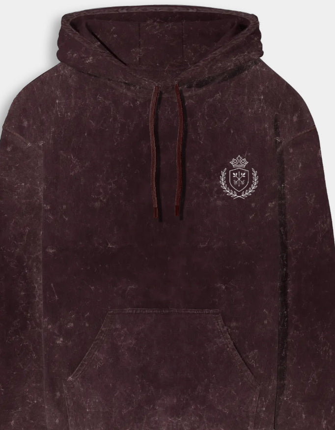 Maroon hoodie with a logo on the chest against a light gray background