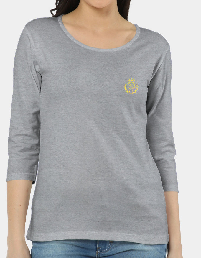 Gray long-sleeve shirt with a yellow emblem worn by a person on a white background
The Linea Tee