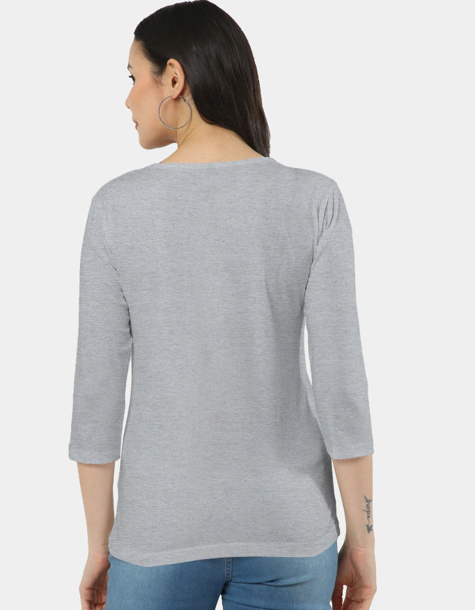 Woman wearing a gray long-sleeve top on a white background
The Linea Tee