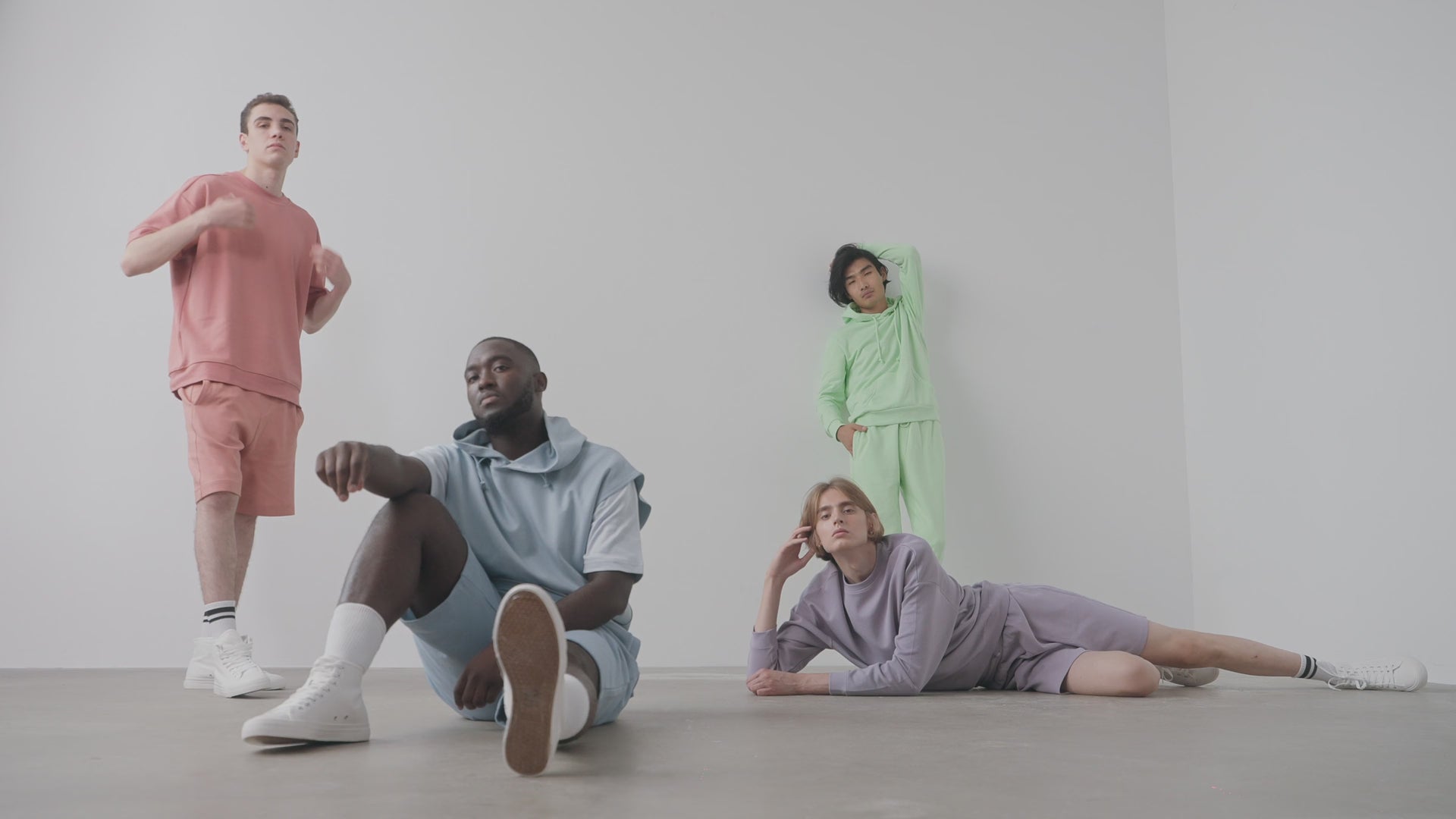 4 male models wearing CozyVora's best and most comfortable T-shirt, Sweatshirt, Hoodies, and shorts