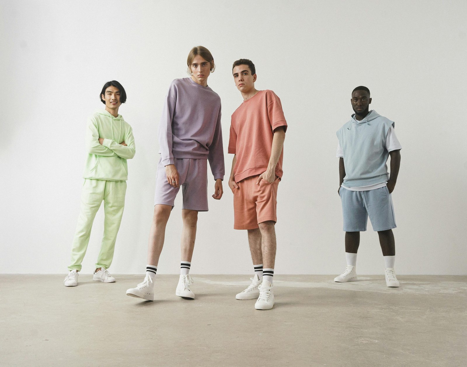 Four CozyVora models wearing pastel-colored comfy outfits standing against a plain background 